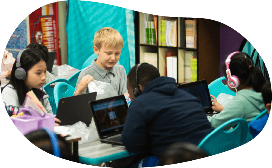 Students using laptops and tablets in an AI-supported classroom